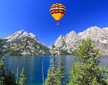hot air balloon over mountains